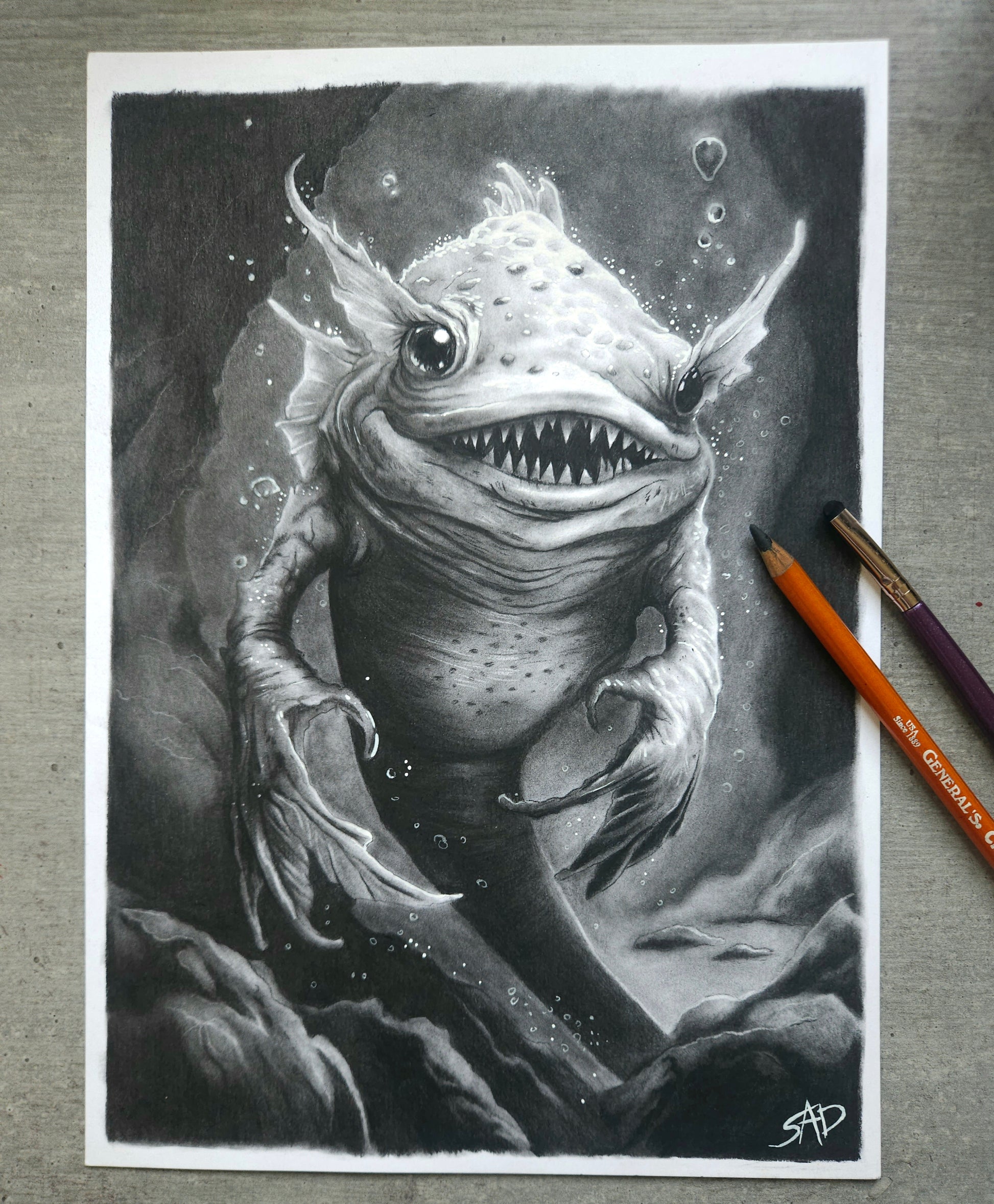 Dark fantasy charcoal artwork “Smiler from the Depths” by S.A.D Illustration, creepy monster portrait with glowing eyes and unsettling smile.
